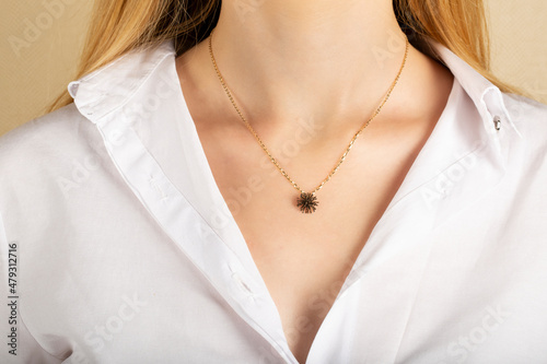 Close portrait of female model in gold and silver rings. Isolated on white background . Diamond jewelry. Diamond ring in women's hands