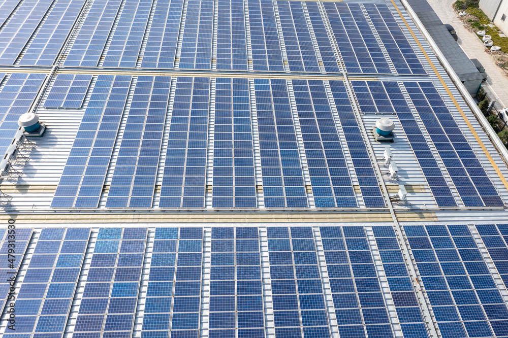 Solar panels on factory rooftop Solar panels on factory rooftop