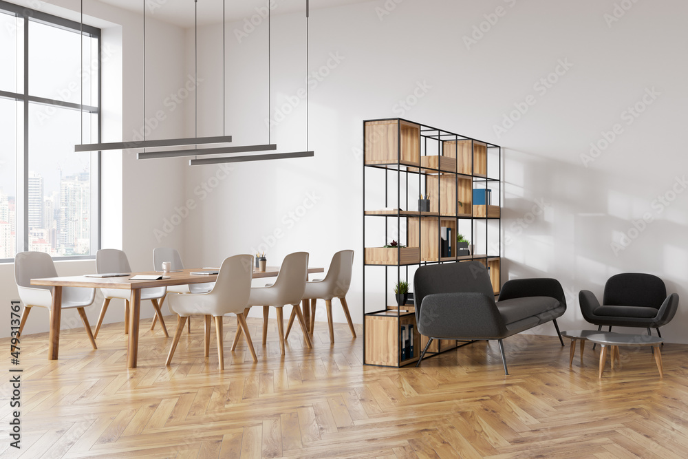 Light meeting room interior with seats, table with laptop, sofa with coffee table Light meeting room interior with seats, table with laptop, sofa with coffee table