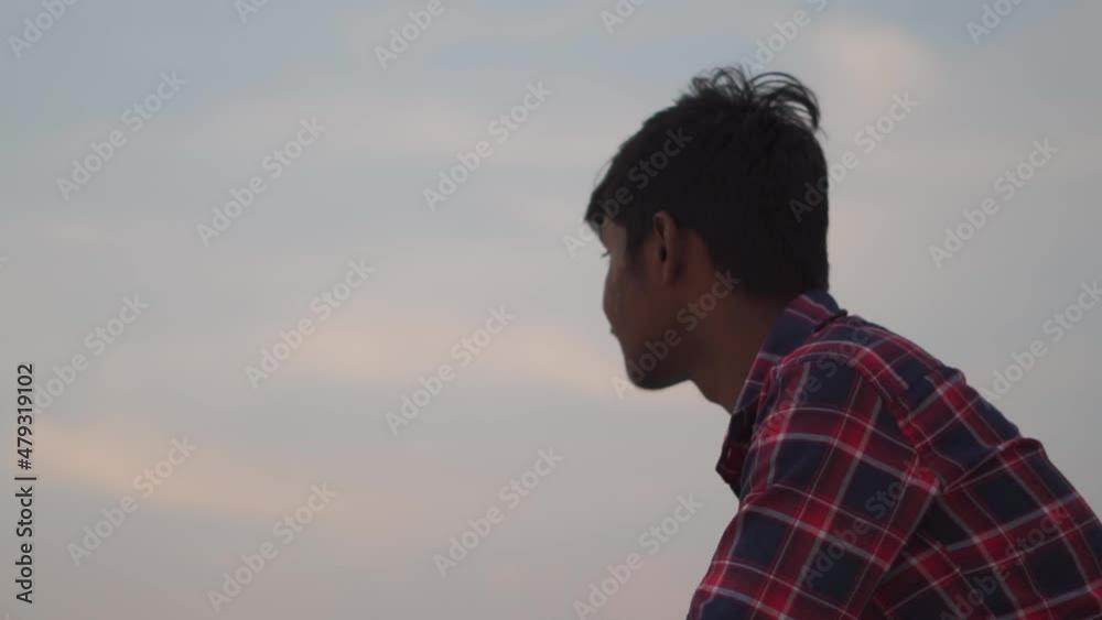 Portrait of an Indian kid turning his head and looking at the sky. Kid looking at the sky in search of hope. Hope concept. Kid imagining his future by looking at the sky. Portrait of an Indian kid turning his head and looking at the sky. Kid looking at the sky in search of hope. Hope concept. Kid imagining his future by looking at the sky.
