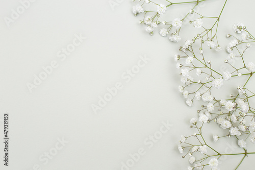 Flower arrangement - white gypsophila flowers on a textured background.
