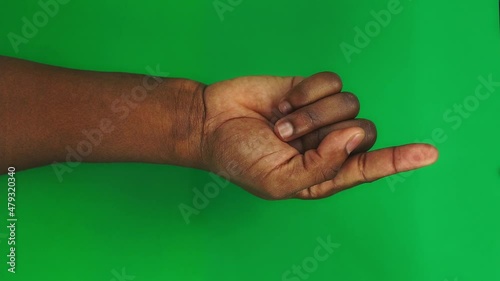 15 gestures Package for controlling touch screen with male Black hand on green screen. Beautiful men fingers with well-groomed manicure is ready for chroma keying. Set of arms for controlling touchpad