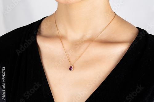 Diamond and gold. Close-up detail of young lady's diamond and gold necklace