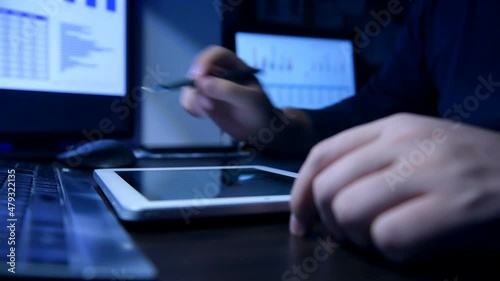 Businessman Working In Night Office And Calculating Spreadsheet Reports. Business, Financial And Analyzing Concept. Close Up