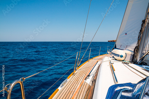 Sailing yacht on course to Cuitadella de Menorca, Spain, Baleares