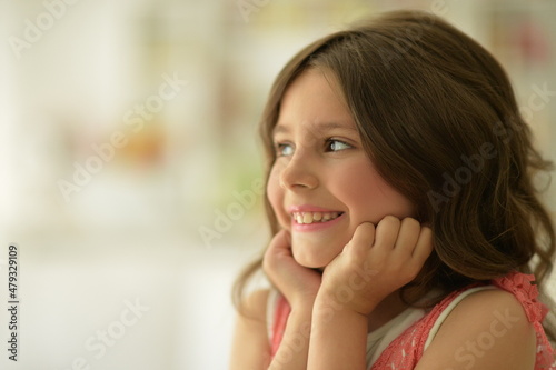 beautiful happy girl looking away indoors