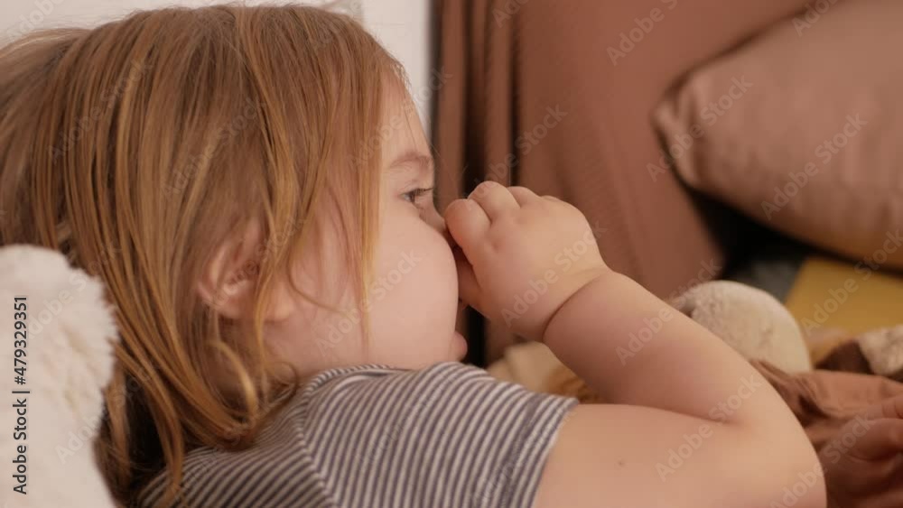 little girl child picks at nose, gets goats, hygiene, habit. Funny, sweet.