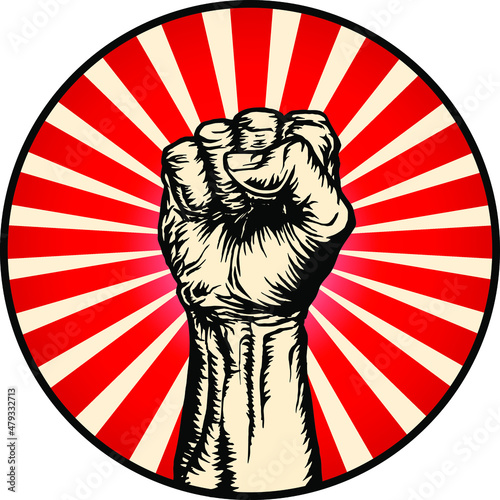 Vector illustration of strong raised fist in a ray red circle background in the style of soviet propaganda posters.