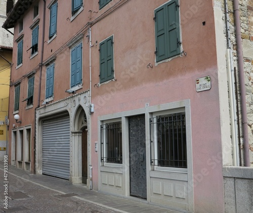 Cividale del Friuli Street View with Pink Bulding Facades and Green Shutters, Italy © Monica