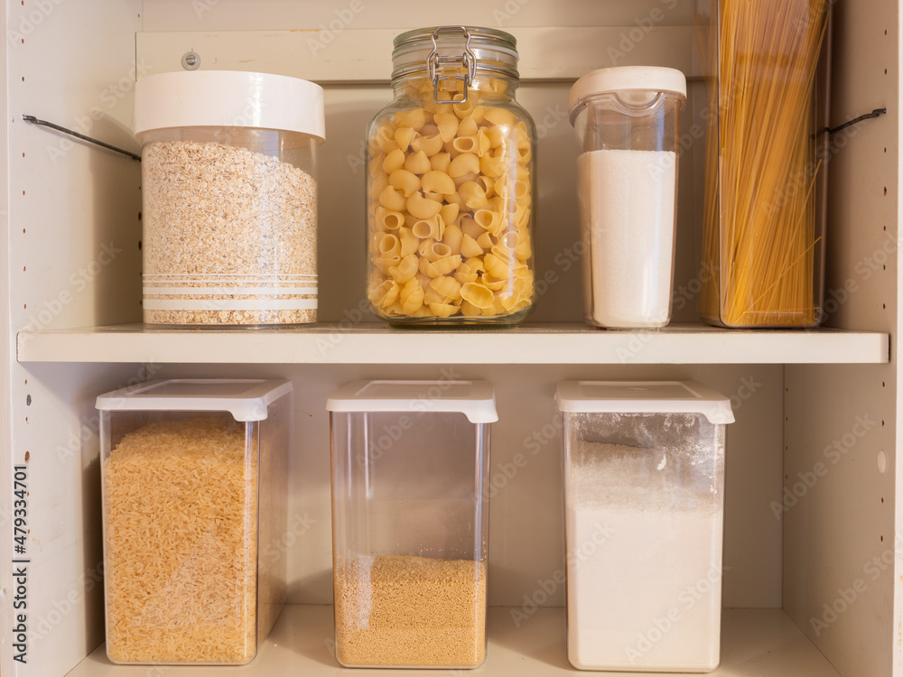 Various dry goods on a shelf. Jars of pasta and other carbon hydrate rich foods. Prepping inspiration. Various dry goods on a shelf. Jars of pasta and other carbon hydrate rich foods. Prepping inspiration.