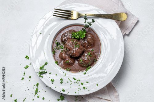 Traditional stew of homemade beef and lamb meatballs in tomato sauce