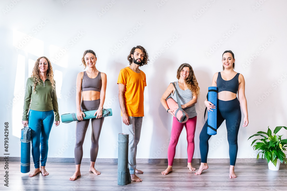 Fototapeta premium Man and women in yoga studio