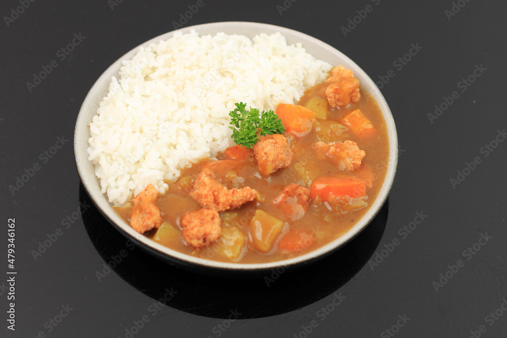 Japanese ordinary curry rice (Potatoes, carrots, onions and beef in spicy yellow curry served with steamed rice.) Japanese ordinary curry rice (Potatoes, carrots, onions and beef in spicy yellow curry served with steamed rice.)
