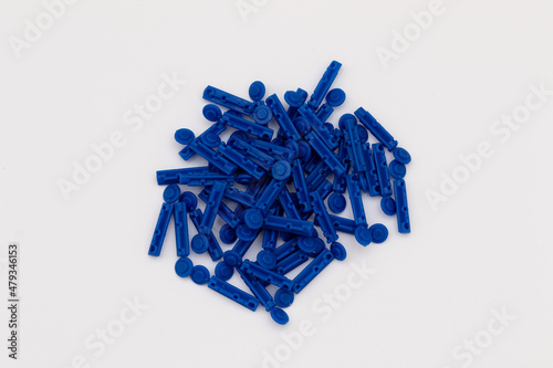 Lancets for lancing device on white background. Diabetic gadgets