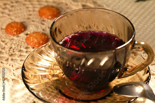 Cozy homemade tea with loved ones. A cup of warm rich aromatic tea.