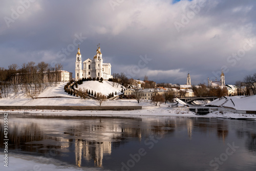 Fototapeta Naklejka Na Ścianę i Meble -  View of the Assumption Mountain, the Holy Spirit Monastery and the Holy Assumption Cathedral on the banks of the Western Dvina and Vitba rivers on a sunny winter day, Vitebsk, Belarus