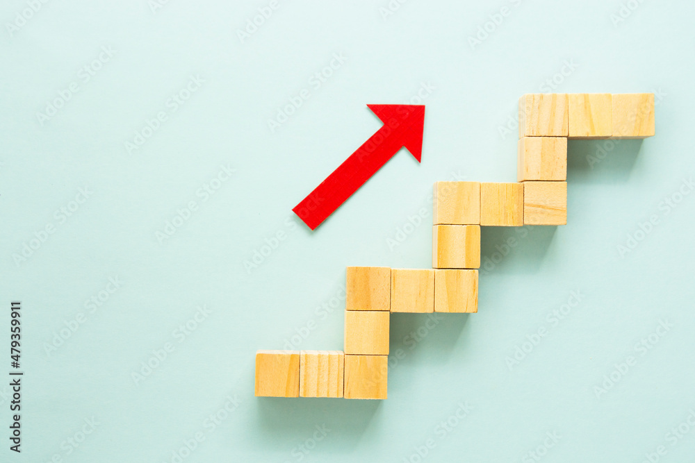 Business growth concept abstract blue background. Red arrow and wooden stairs. Business growth concept abstract blue background. Red arrow and wooden stairs.