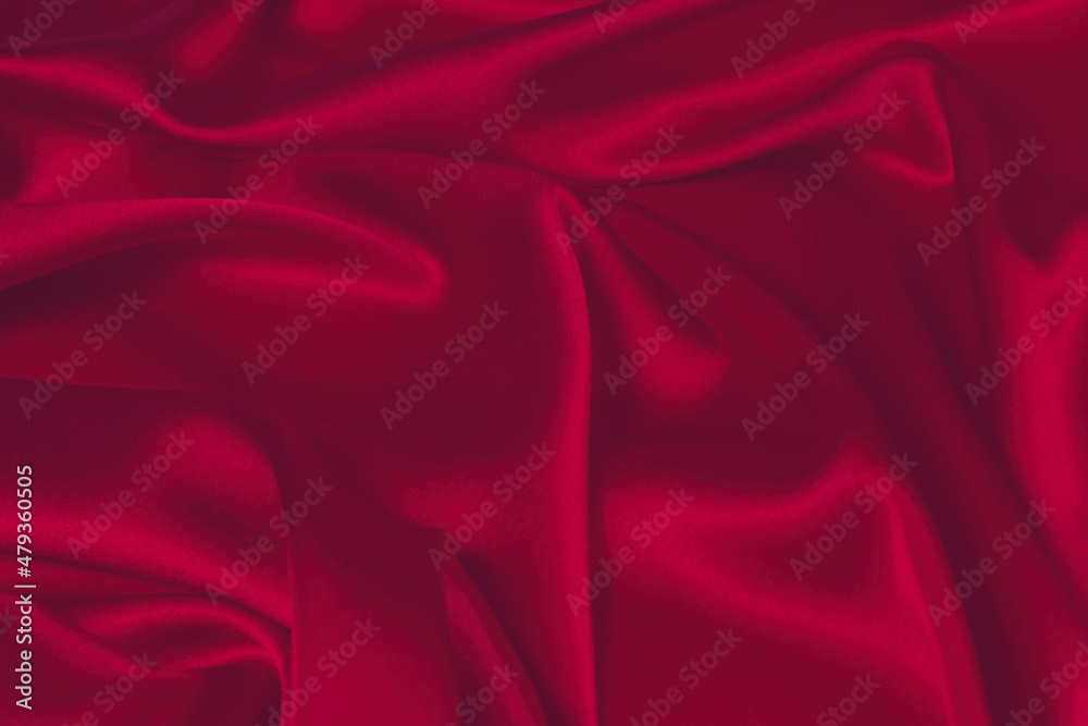 Obraz premium Red silk or satin luxury fabric texture can use as abstract background. Top view.