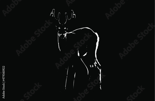 silhouette of a startled scared deer in nature