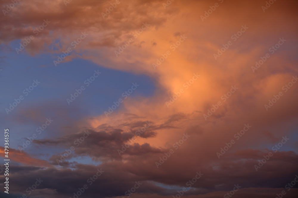 Sky with clouds at sunset. Beautiful background for text.
