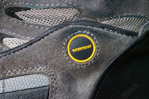 Фотография Waterproof winter shoes boots with waterproof leather sign on a bootleg