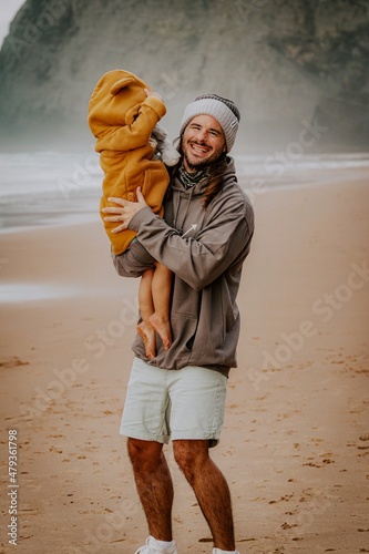 men playing with her daughter on the beach in Portugal Algarve fatherlove photo