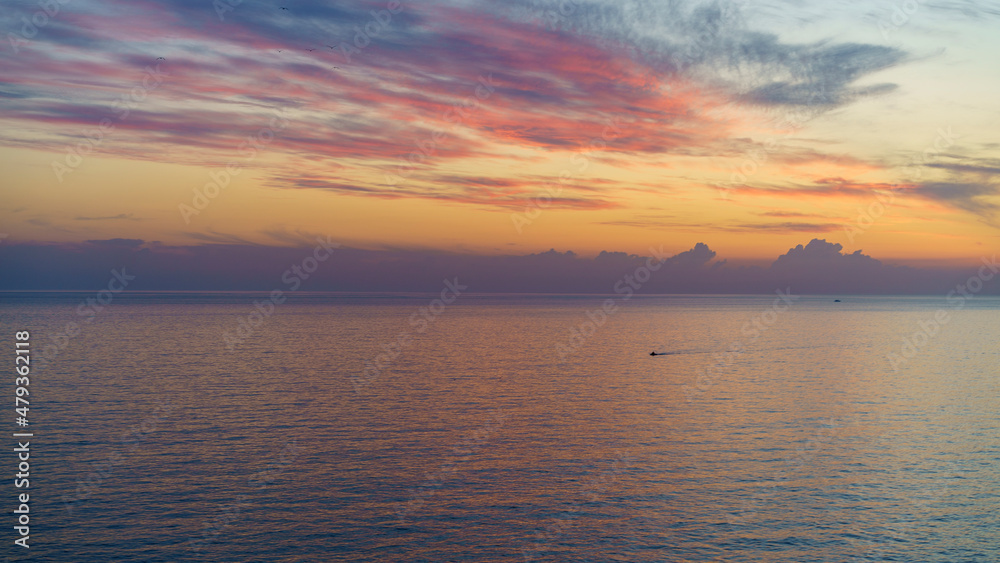 Seascape with a beautiful dramatic sunset.