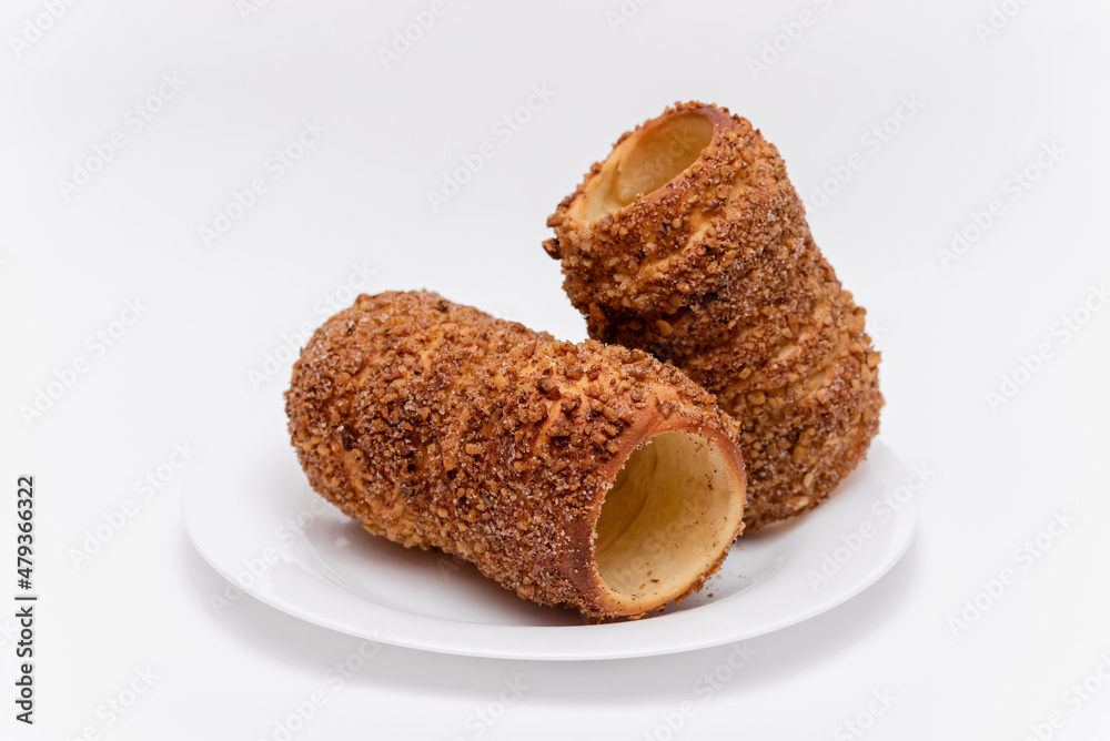 trdelnik on a on a white plate on a white background trdelnik on a on a white plate on a white background