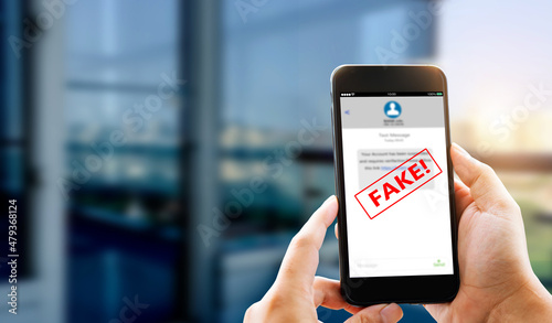 Fotografiet Fake Text message SMS scam or phishing concept