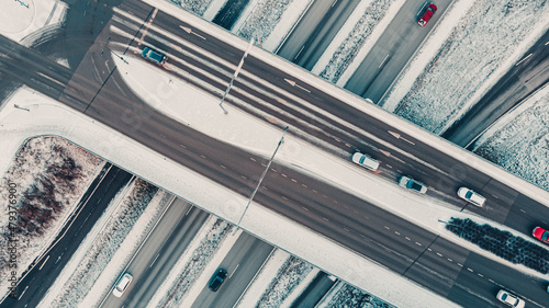 Street intersection in winter, aerial view. Low traffic on snowy winter day