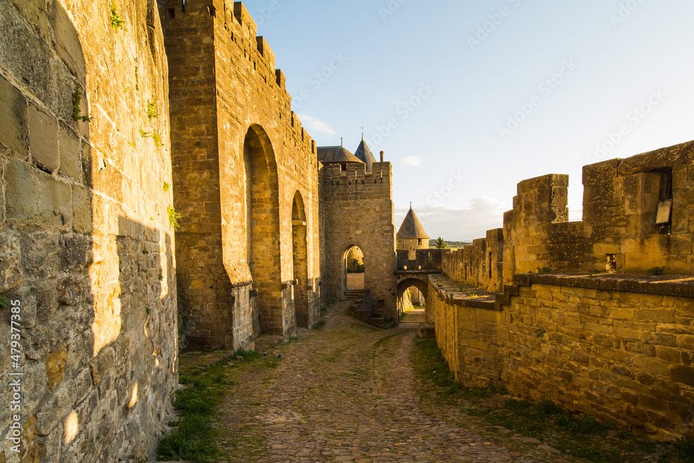 Carcassonne (France) Medieval Citadel Entrance Door  and Battlements at Sunset