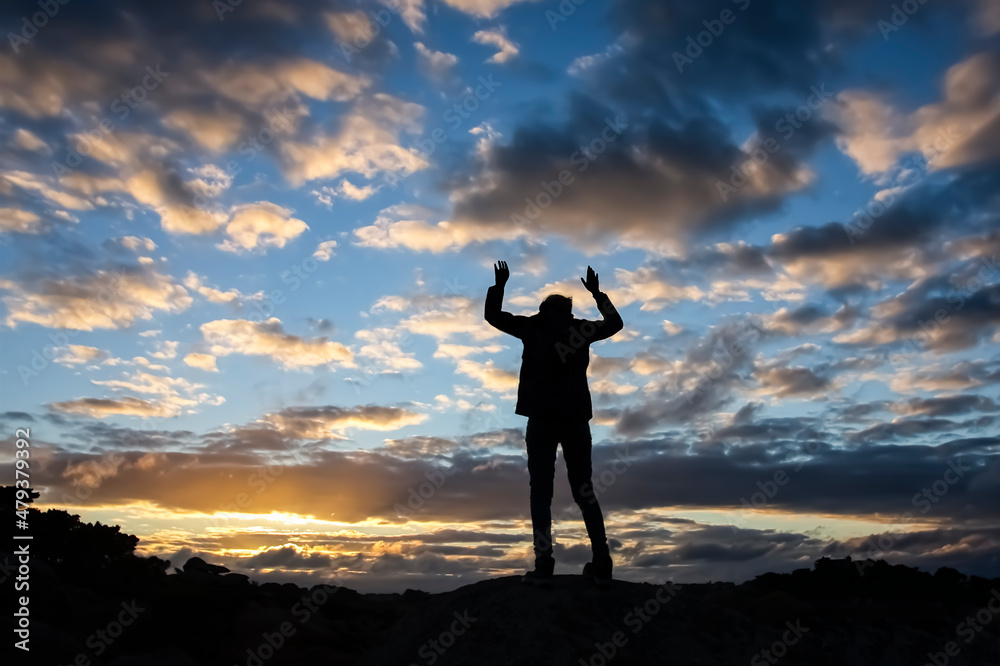 Rear view of a person against the cloudy blue sky