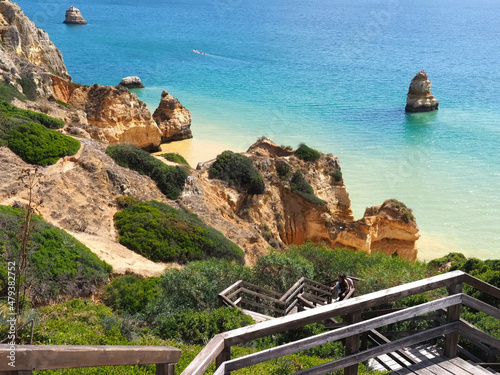 Algarve in Portugal at Camilo beach in Lagos - beautiful panorama of cliffs and the turquoise Atlantic ocean