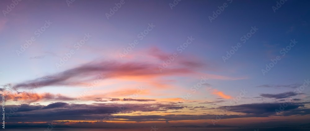 A panorama of a colorful dusk sky as a background or texture