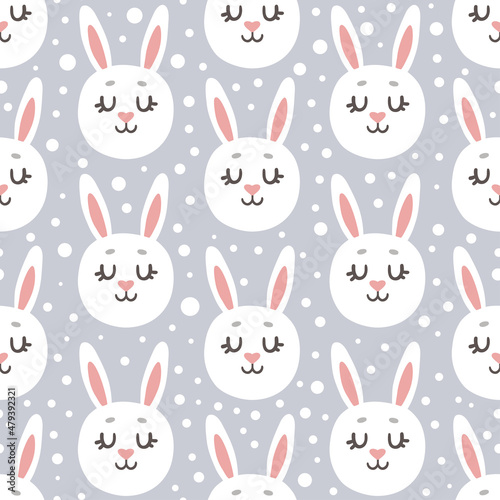 children s print with the faces of white rabbits on a gray background with snow. cute vector seamless pattern. bunny  hare