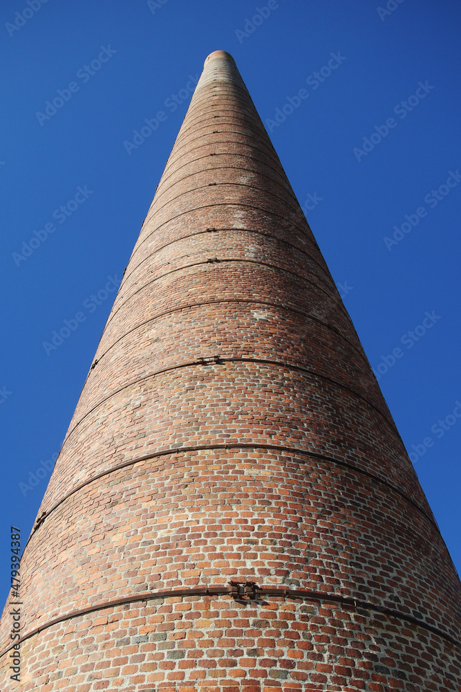 An old brick chimney at the beach in Malaga, Spain