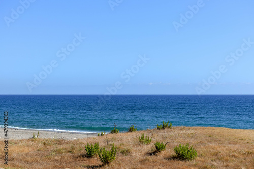 Fototapeta Naklejka Na Ścianę i Meble -  View from the coast to the Mediterranean Sea in the south of Turkey on a summer day.