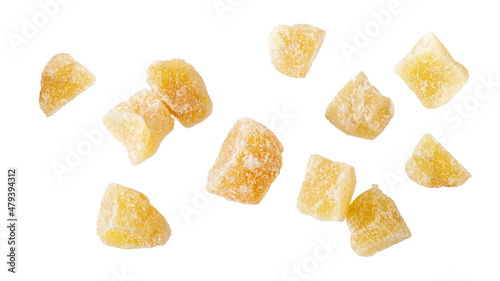 Candied ginger root pieces with sugar flying isolated on white background.