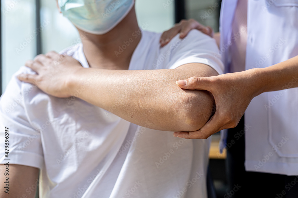 A physical therapist is doing physical therapy on a patient, the patient has muscle dysfunction due to hard work, most often an office worker who has problems sitting for long periods of time. A physical therapist is doing physical therapy on a patient, the patient has muscle dysfunction due to hard work, most often an office worker who has problems sitting for long periods of time.