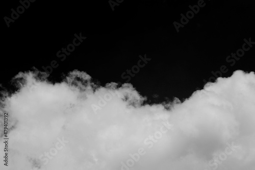 Clouds over black background .