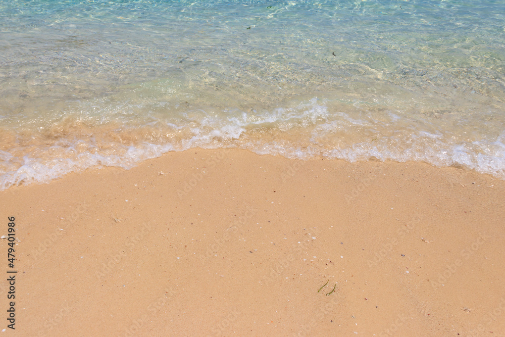 Soft wave of ocean on sandy beach