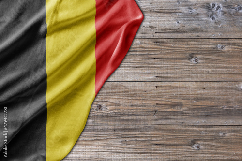 Wooden pattern old nature table board with Belgium flag