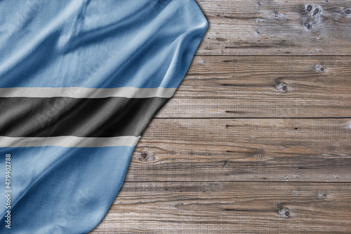 Wooden pattern old nature table board with Botswana flag