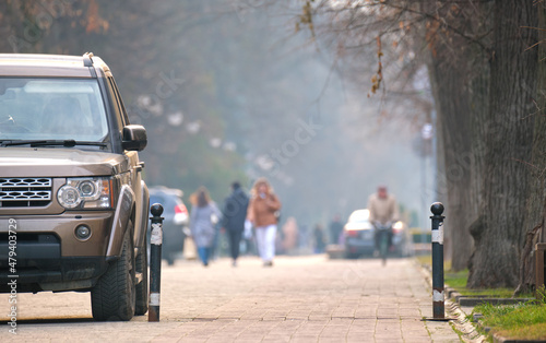 Close up of a car parked illegally against traffic rules on pedestrian city street side