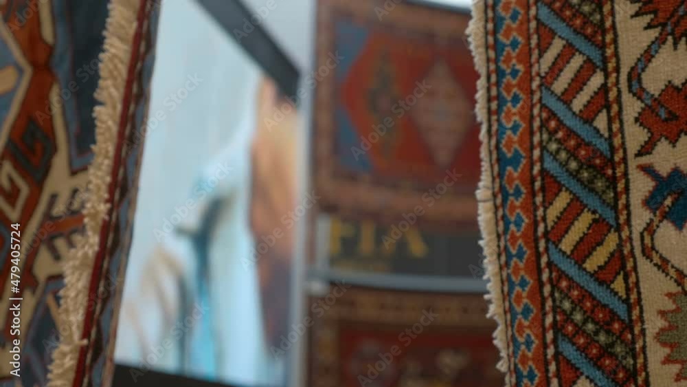 Beautiful handmade carpets from Asian countries are shown at the exhibition. Shot in motion. Closeup