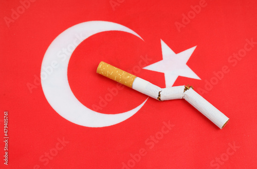 A broken cigarette is on the flag of Turkey, as a symbol of the harm of smoking.