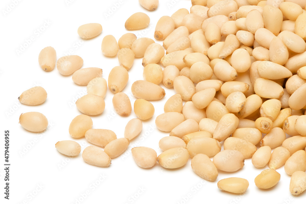Peeled pine nuts isolated on white background. Healthy nuts snacks. Clipping path, full depth of field. Closeup view. Peeled pine nuts isolated on white background. Healthy nuts snacks. Clipping path, full depth of field. Closeup view.