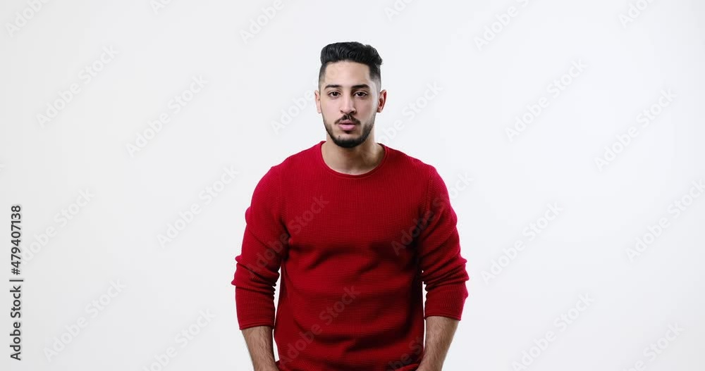 Man saying no by shaking his head and gesturing over white background Man saying no by shaking his head and gesturing over white background