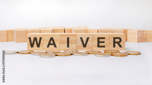 waiver concept, wooden word block on grey background photo