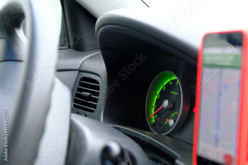  Car dashboard modern car control with green illuminated speed panel, Highlighted repair icons. Automatic transmission. Auto Navigator on background